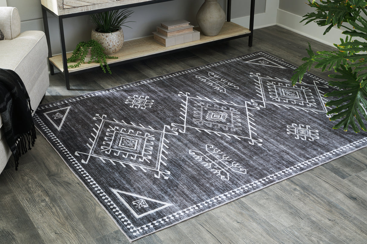 Nashville Furniture Outlets - Ashley Furniture - Arloman Rug - 5' x 7' Washable Rug / Black/Cream/Gray - R405932