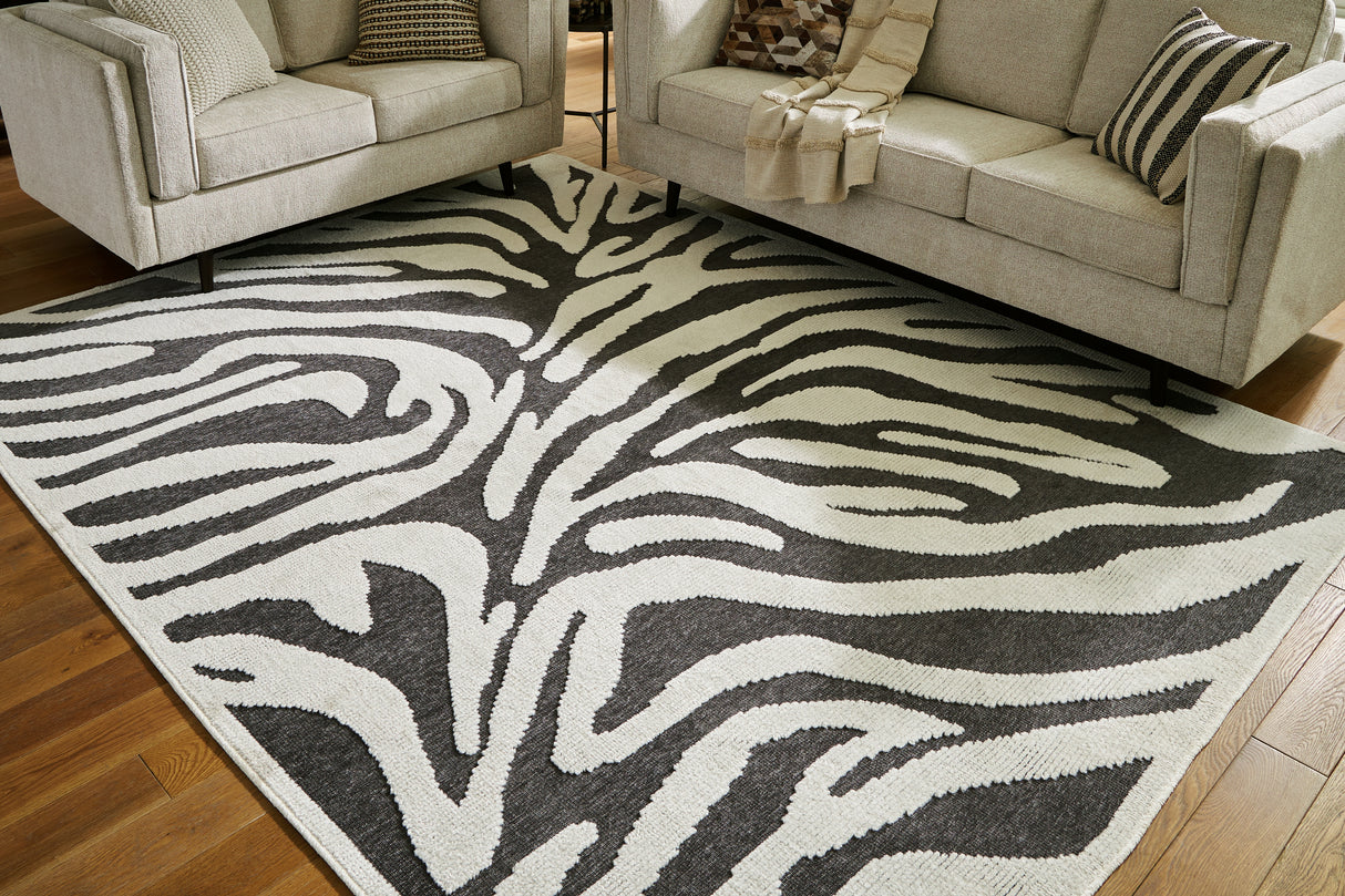 Nashville Furniture Outlets - Ashley Furniture - Thomwith Rug - 8' x 10'2" Washable Rug / Black/Ivory - R406291