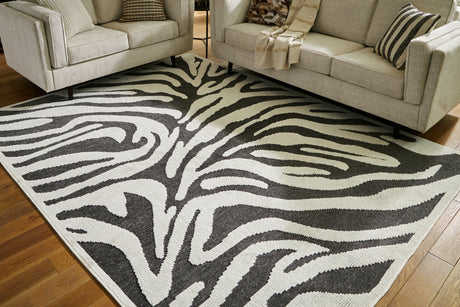 Nashville Furniture Outlets - Ashley Furniture - Thomwith Rug - 8' x 10'2" Washable Rug / Black/Ivory - R406291