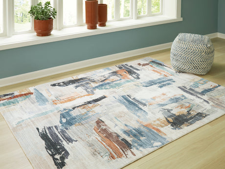 Nashville Furniture Outlets - Ashley Furniture - Hessland Rug - 5' x 7' Washable Rug / Multi - R407052