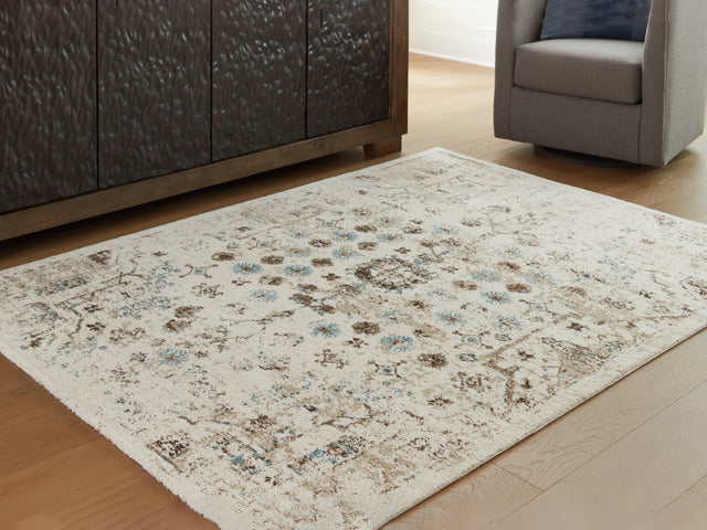 Nashville Furniture Outlets - Ashley Furniture - Jossler Rug - 5' x 7' Rug / Ivory/Brown/Teal - R407072