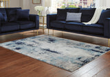 Nashville Furniture Outlets - Ashley Furniture - Leonelle Rug - 7'10" x 10' Rug / White/Blue/Gray - R404871